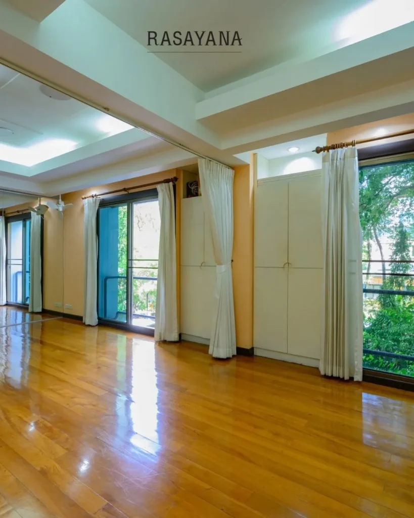 Large studio hall with polished wooden floor for workshops, yoga classes and events at Rasayana Retreat, Sukhumvit 39, Bangkok